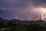 Lightning over mountains to the SE of Vail AZ.jpg